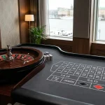 Dealer vid ett roulettebord med studiobelysning och spelmarker